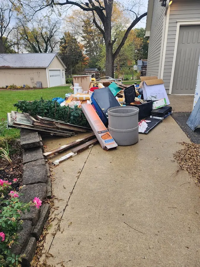 Dumpster being loaded with debris for Demolition Dumpster Rental in Lindon